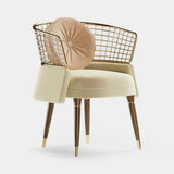 Mezzo Collection Frida Dining Chair, Alhambra Jimena 17 and 12 fabric, matte walnut frame, polished brass, available from Touched Interiors UK