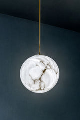 United Alabaster Moon Pendant Light in natural alabaster with a satin gold brass stem