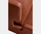 Alessio armchair, close-up of the rust leather and stepped arm
