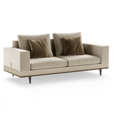 Aster Gibbings Sofa, moka oak stain matte wood and brushed brass, available from Touched Interiors UK