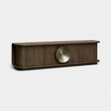 Berkeley Designs Perth Media Unit, textured light brown oak veneer with brushed brass disc handle, angled view