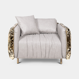 Boca do Lobo Imperfectio Armchair in ivory upholstery with hand-hammered brass, available from Touched Interiors UK