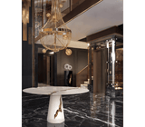 A Play of Light and Shadow: The Boca do Lobo Lapiaz White Dining Table - The Boca do Lobo Lapiaz White Dining Table showcases a captivating interplay of light and shadow on its lacquered mahogany surface accented with polished brass. This white iteration offers a modern interpretation of the brand's signature design.