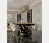 Boca do Lobo Newton Black Gold Dining Table beneath a statement chandelier in a luxury dining room