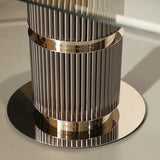 Castro Lighting Eléa Glass Dining Table in polished brass with a glass top, available from Touched Interiors UK
