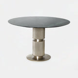 Castro Lighting Eléa Round Dining Table in polished brass with a marble top, available from Touched Interiors UK