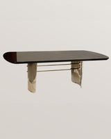 Castro Lighting Moon Dining Table in polished brass with a marble top, available from Touched Interiors UK