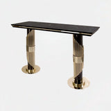 Castro Lighting Streamline Console Table in polished brass with a black marble top, available from Touched Interiors UK