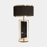 Castro Lighting Petra Table Lamp in gold-plated brass with Nero Marquina marble and a black lampshade, available from Touched Interiors UK