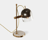 Illuminate Your Living Room with the Cooper Table Lamp. Add a touch of sophisticated elegance to your living room with the Cooper table lamp. This classic design by Mezzo Collection features a luxurious blend of Carrara marble, gleaming gold-plated brass, and a sleek glass shade, providing both beauty and function.