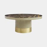 Curvo luxury round dining table with Port Saint Laurent marble top and satin brass pedestal