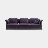 Desenzano Low Rail Luxury Sofa in blueberry velvet with brown burnished brass