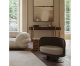 Espresso Cup Inspiration: The Modern Embrace Armchair by Touched Interiors - Experience the modern interpretation of a classic design with the Espresso Modern Embrace Armchair by Touched Interiors. Inspired by the curves of an espresso cup, this captivating piece offers exceptional comfort and a touch of modern sophistication. The sleek epoxy iron base with a stunning bronze finish adds a touch of elegance. A perfect statement piece for any living space.
