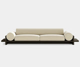 Modern luxury sofa with oak base and soft fabric upholstery.
