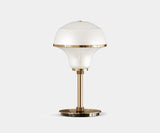 Illuminate Your Entryway with the Harlow Table Lamp. Add a touch of mid-century modern elegance to your entryway with the Harlow table lamp. This luxurious lamp by Mezzo Collection features a captivating design in glass, marble, and gold, casting a warm and inviting glow.
