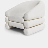 High-end cream velvet accent chair featuring polished brass details, ideal for luxury living spaces.