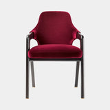 Luxury dining chair in wine red velvet with matt black ashwood frame and satin brass feet, front view