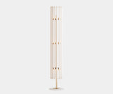 Illuminate Your Reading Nook with the Lumière Mid-Century Floor Lamp. Create a cozy and stylish reading nook with the Lumière floor lamp by Mezzo Collection. This minimalist masterpiece features a white metal exterior and a warm gold-plated interior, bathing your space in a soft, inviting light for an elevated reading experience.