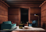 Touched D luxury sofa in teal velvet with satin brass base in a wood panelled living room