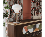 Harlow Table Lamp: A Touch of Retro Chic for Modern Bedrooms. Elevate your modern bedroom with the Harlow table lamp. This mid-century modern inspired design by Mezzo Collection features a luxurious blend of glass, marble, and gold, adding a touch of timeless elegance to your nightstand.
