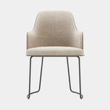 Domkapa Anna Sled Dining Chair with Armrests, view 1, in light beige fabric on a Black Texturized sled