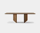 Parallel Lines: Modern Minimalist Dining Table by Outline - This modern dining table by Outline features a stunning walnut veneer tabletop and a base with parallel brushed brass legs, creating a statement piece for minimalist luxury dining rooms.