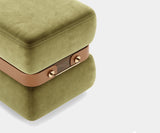Luxury Round Stool with Brass Detail: A touch of timeless elegance for your living room. The Ellington Deco Stool combines a classic round shape with a modern twist. Crafted from walnut wood with polished brass detailing and a luxurious synthetic leather belt, this stool offers both style and comfort.
