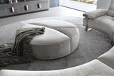 Giorgio Collection Mirage Round Ottoman in light grey velvet with a satin black nickel base, room setting