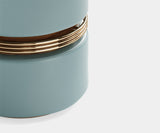 Mid-Century Modern Comfort Meets Art Deco Style: The Macaron Deco Stool by Touched Interiors elevates your space with its captivating blend of styles. This luxurious stool features a sculptural walnut wood frame inspired by the Art Deco era, rich upholstery for comfort, and polished brass accents for a touch of glamour.
