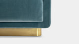Touched D luxury sofa, close-up of the satin brass plinth base and velvet arm