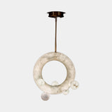 United Alabaster Ozark Pendant Light in natural alabaster, studio view on grey