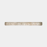 United Alabaster Roller Pendant Light in natural alabaster, studio view on grey