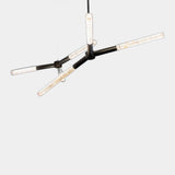 United Alabaster Ypsilon Pendant Light in natural alabaster with a matt black structure, studio view on grey