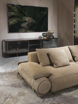 Leather Belt Detail Sofa: Visionnaire's Donovan Roll Sofa boasts a unique design element - two cylindrical upholstered armrests connected with leather belts and metal buckles. This modern detail adds a touch of visual interest to this luxurious sofa.