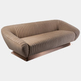 Unwind in Sophisticated Comfort: The Citizen Sofa by Mauro Lipparini. This luxurious sofa boasts an all-over canneté quilted motif, plush Memory Foam® seating, a customisable base, and is available in a one-armrest version for added versatility.