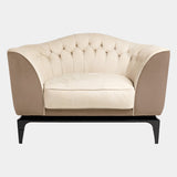 Visionnaire Freyr Armchair: Modern luxury armchair with a curved shell, plush upholstery (leather or fabric options), and slender wooden feet with metal tips.