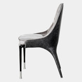Luxury Italian Dining Seating: The Palmyra Chair by Visionnaire offers a sculptural statement piece for your dining room. This chair boasts exceptional comfort with its curved back, memory foam seat, and bespoke upholstery options.