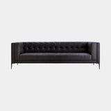 Luxury low black leather sofa with decorative zip detail and black steel feet