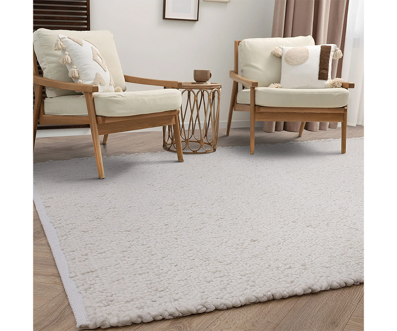 High-end boucle rug enhancing a contemporary living space with soft texture and style.