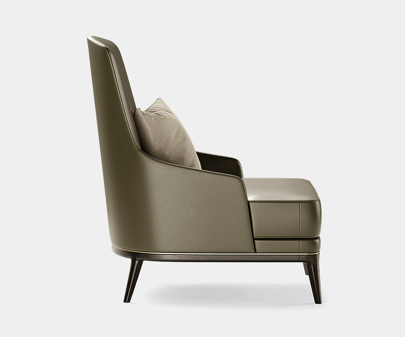 High-end Redd armchair showcasing refined brass details and premium black oak finish for contemporary interiors.