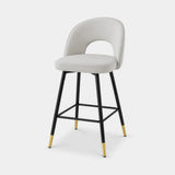 Berkeley Designs Hoxton Bar Stool, light grey upholstery with black metal frame and brass tips, angled view