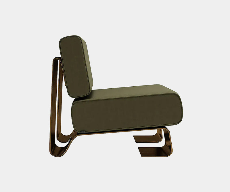 Porus Studio Rushmore Armchair featuring elegant leather upholstery and aged brass feet.