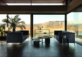 Samira luxury sofas in black leather facing each other in a glass walled living room