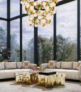 Boca do Lobo Eden Center Table in brass in a light-filled living room