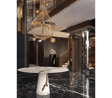 A Play of Light and Shadow: The Boca do Lobo Lapiaz White Dining Table - The Boca do Lobo Lapiaz White Dining Table showcases a captivating interplay of light and shadow on its lacquered mahogany surface accented with polished brass. This white iteration offers a modern interpretation of the brand's signature design.