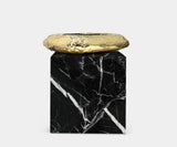 Close-up of the Boca do Lobo Stonehenge side table with sophisticated marble and brass accents.