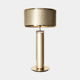 Castro Lighting Bauhaus Table Lamp in gold-plated brass with a fabric lampshade, available from Touched Interiors UK