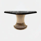 Castro Lighting Flusso Console Table in polished brass with a marble top, available from Touched Interiors UK