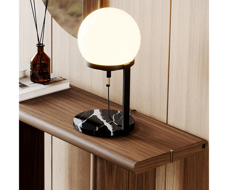 High-end table lamp by Laskasas with a distinctive spherical glass shade and a luxurious marble base.