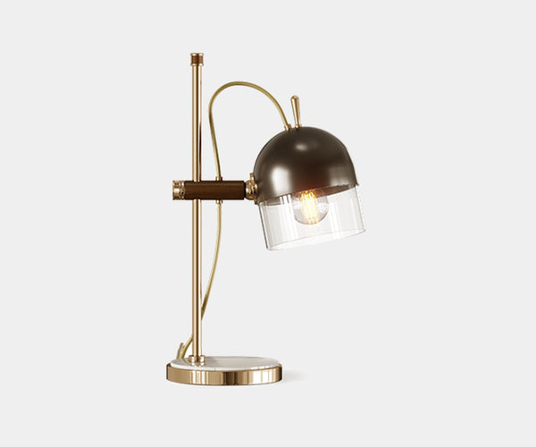 Cooper: Classic Table Lamp in Marble, Brass & Glass.  The Cooper table lamp by Mezzo Collection embodies timeless elegance.  This exquisite piece features a classic blend of Carrara marble, gleaming gold-plated brass, and a sleek glass shade, casting a warm and inviting glow in any modern living space.